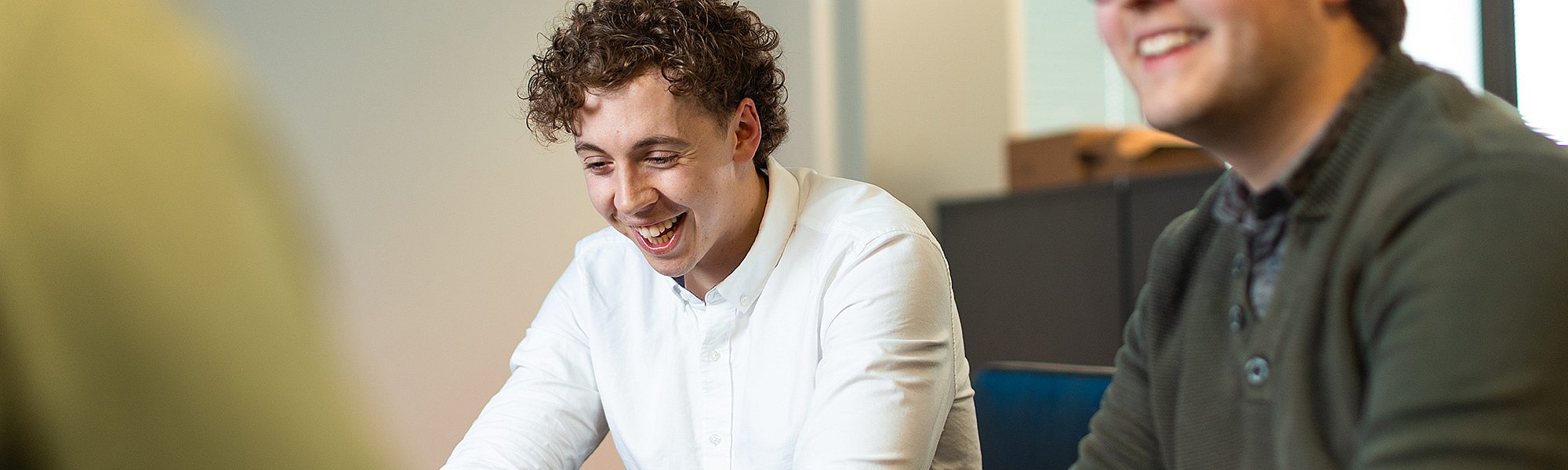 IT students working at their laptops
