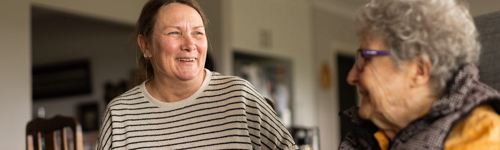 Aged care worker supporting a client at home